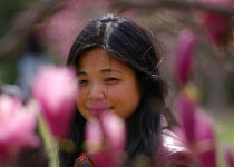 Photo of a lady framed by flowers